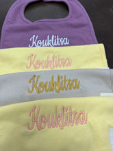 Load image into Gallery viewer, Embroidered Baby Bib “Kouklitsa” Design—Multiple color choices (free USA shipping included)
